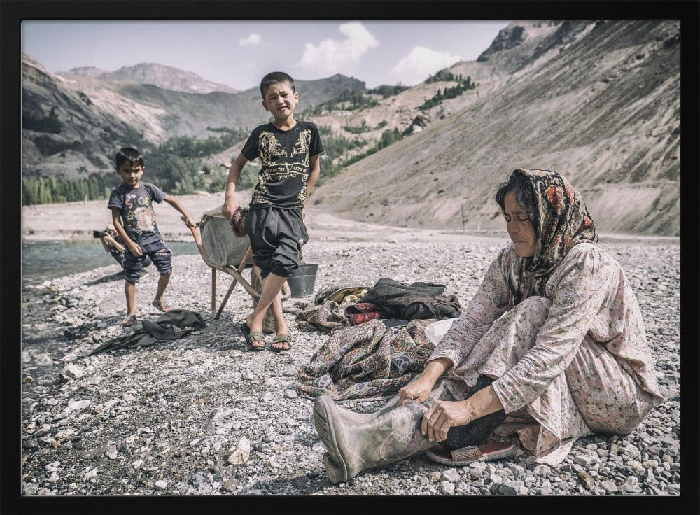 A Tajik woman is preparing to wash in the stream Poster