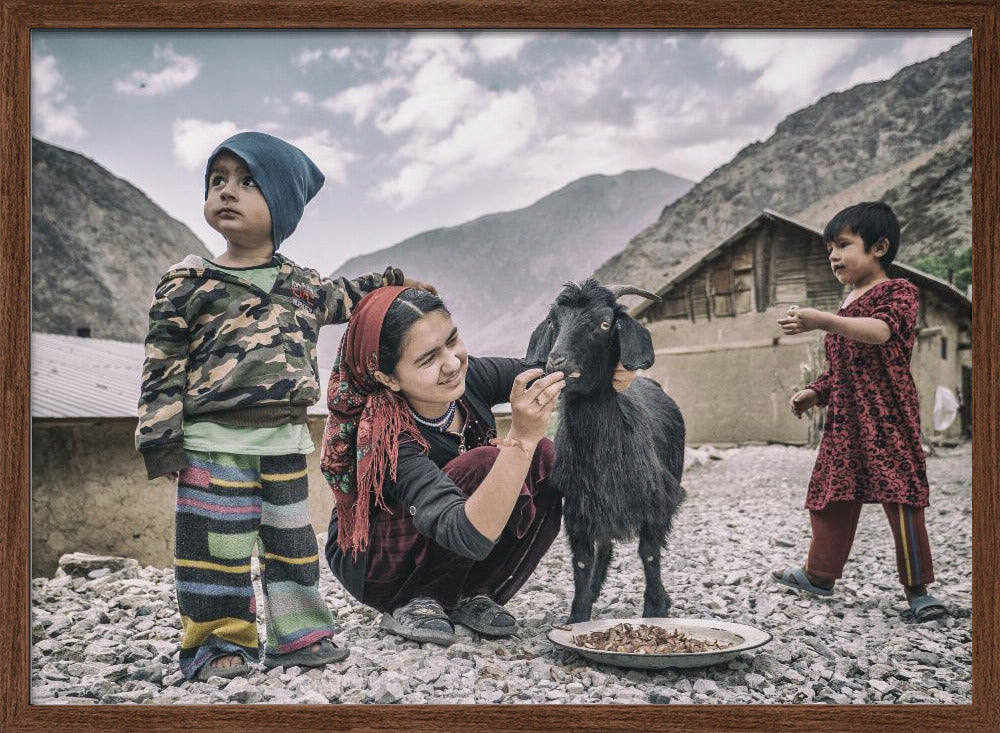 Kids and a goat in the village of Padrud Poster