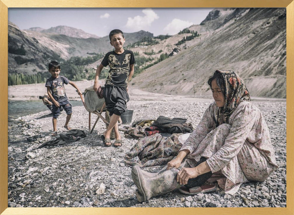 A Tajik woman is preparing to wash in the stream Poster