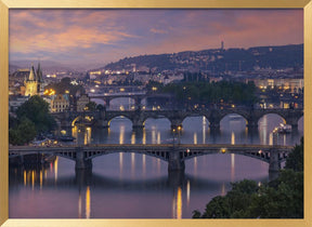 Evening view over the Vltava bridges in Prague Poster