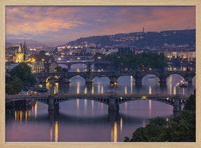 Evening view over the Vltava bridges in Prague Poster