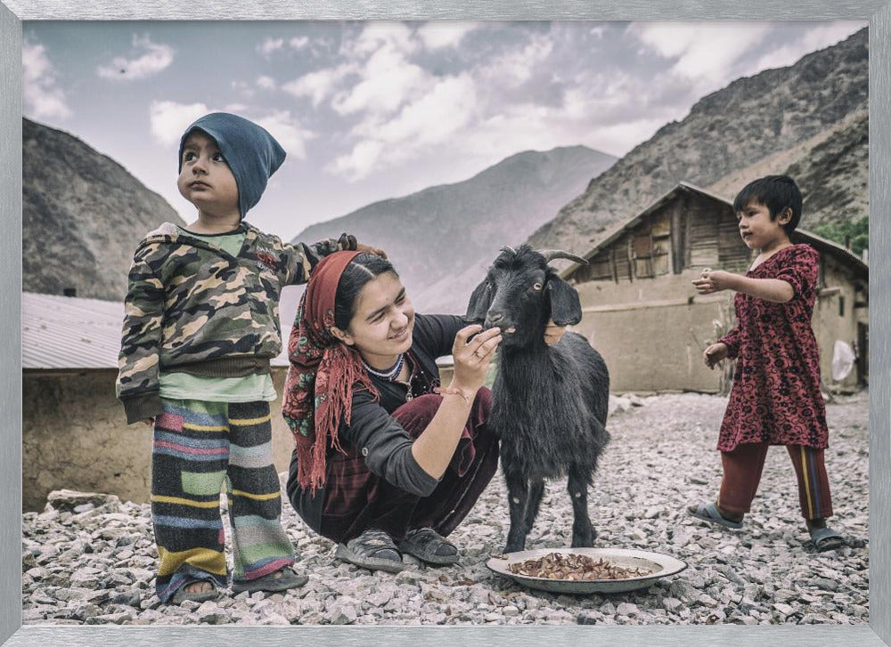 Kids and a goat in the village of Padrud Poster