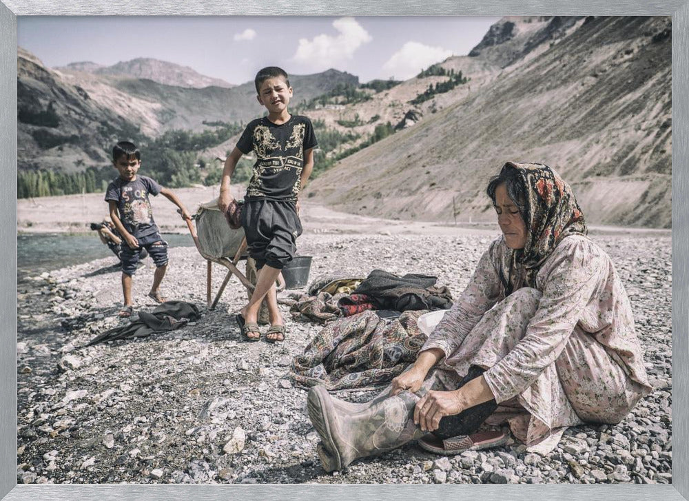 A Tajik woman is preparing to wash in the stream Poster